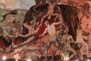 Peinture ancienne représentant l’enfer selon la tradition médiévale, symbole de peur contrastant avec le message biblique d’amour et de justice.